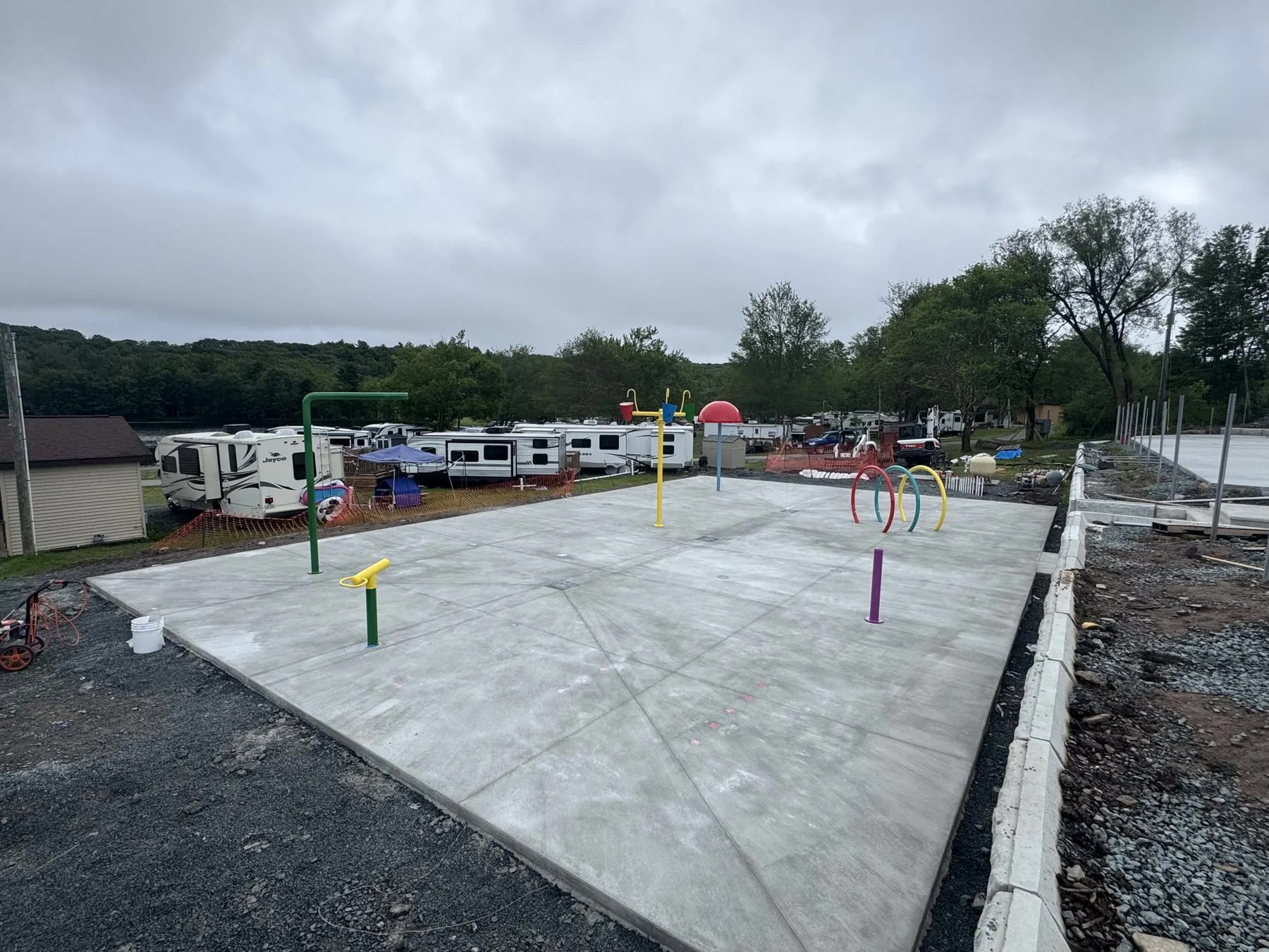 Lake commercial campground hardscaping and pool area project by ASRE photo 5