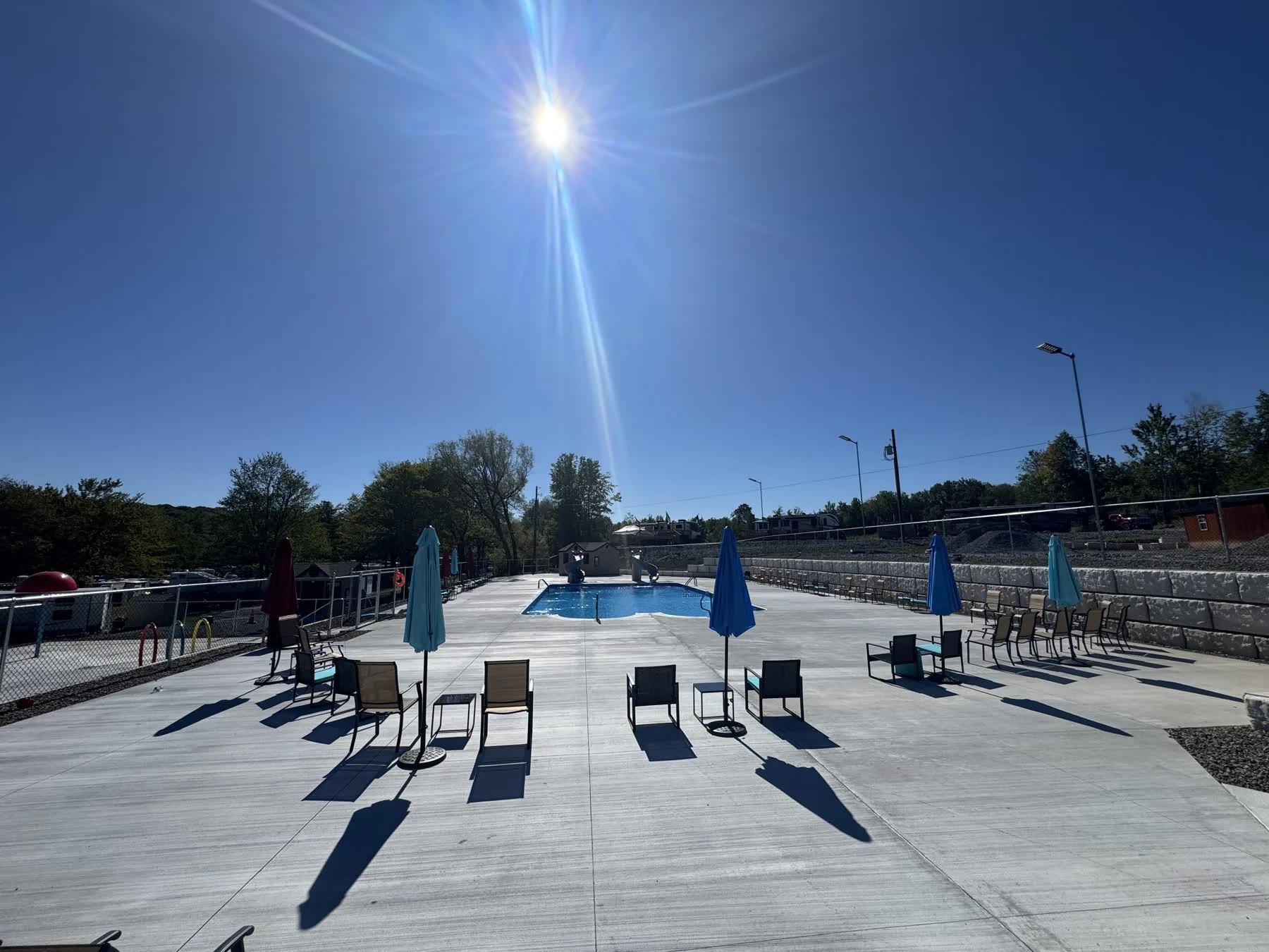 Lake commercial campground hardscaping and pool area project by ASRE photo 7