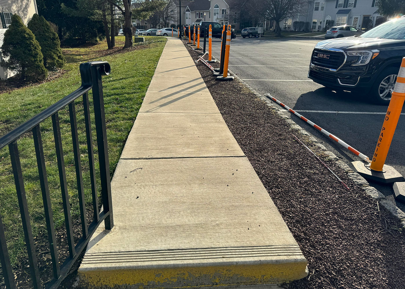 New concrete sidewalk and railing area at Society Hill project by ASRE