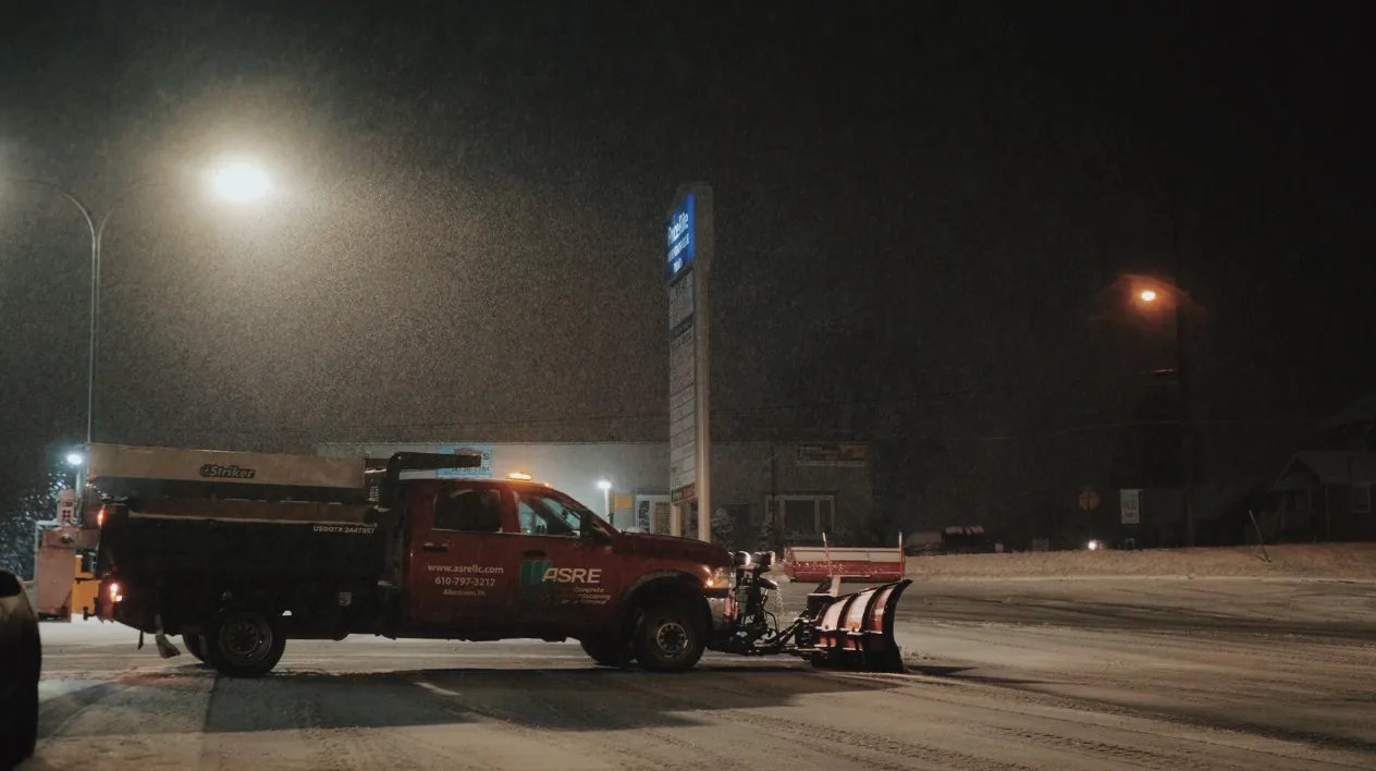 Snow Plow Clearing a Commercial Property